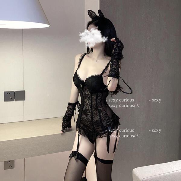 Seductive lace lingerie set featuring sheer mesh bodysuit and garter stockings, perfect for women seeking allure and elegance...
