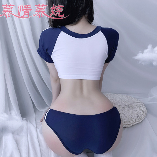 Woman wearing a sexy collegiate-style lingerie set with a high-waisted bikini top and shorty bottoms, enhancing a small bust.