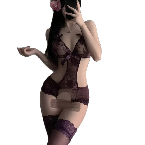 Woman wearing sheer purple lace bodysuit with open crotch, bow detail, and thigh-high stockings; ideal for small bust.