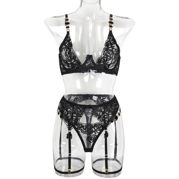 Sexy black lace lingerie set with floral embroidery, featuring a bra, thong, and garter straps on a mannequin.