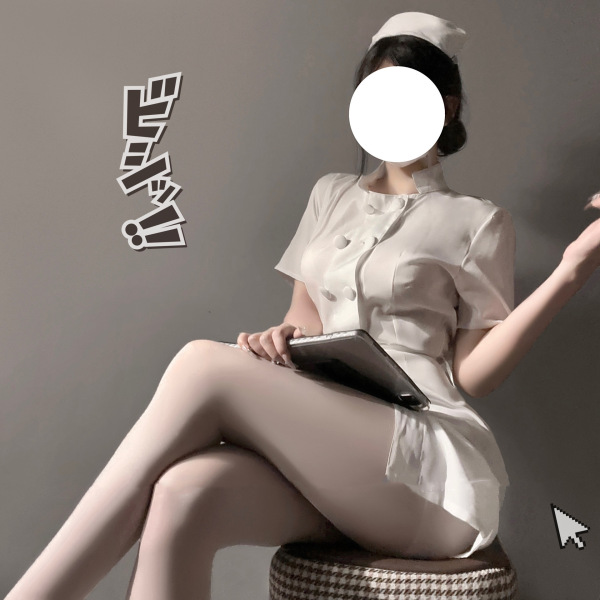 Woman in white nurse costume with bow-tie skirt and round neck top, holding tablet, seated on stool.