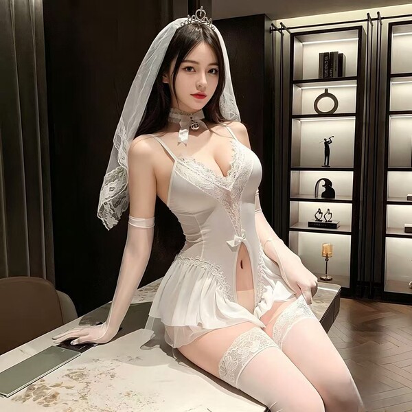 Woman in white lace bridal bodysuit with veil, thigh-high stockings, and open-crotch design for intimate wear.