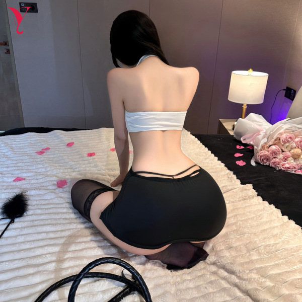 Woman wearing sexy secretary role play outfit - bodycon mini dress with black stockings and accessories for nightclub & bedro...