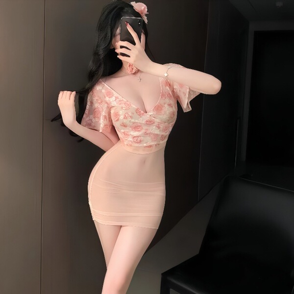 Woman wearing sexy sheer deep v floral lace high-waist bodycon dress set, posing with phone in mirror selfie.