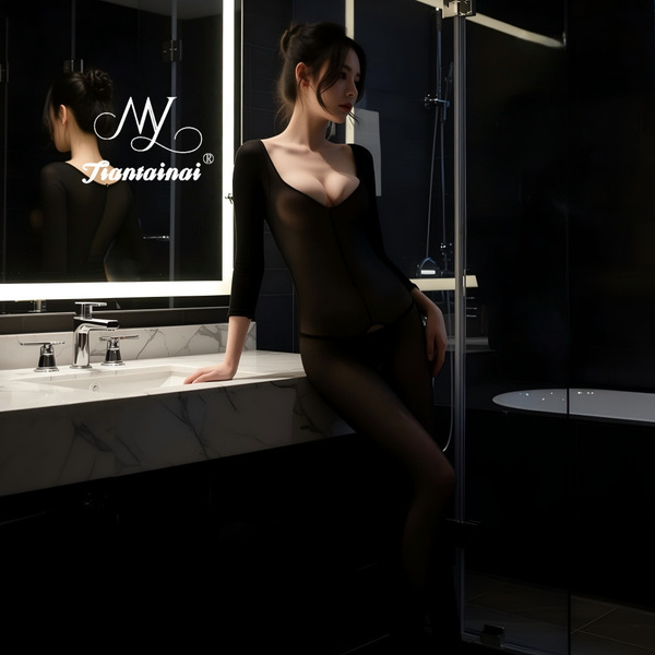 Sexy sheer bodysuit with open crotch design, transparent material, elegant and seductive look, perfect for intimate wear.