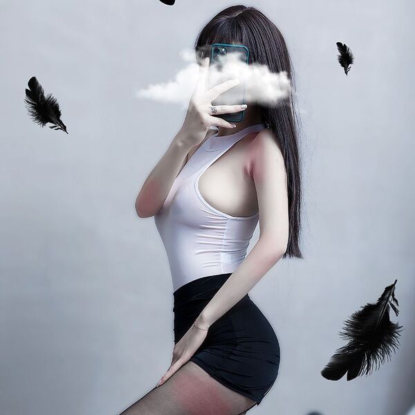 A woman poses with a smartphone, partially obscuring her face with smoke. she wears a white open-crotch bodysuit paired with ...