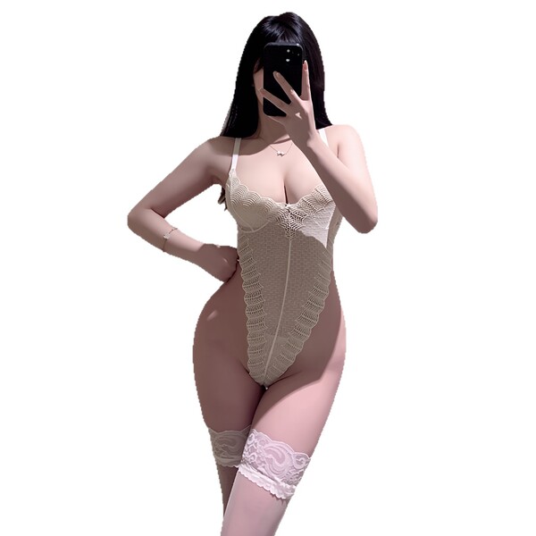 Woman modeling beige lace bodysuit with sheer back, tight fit, and matching thigh-highs for date night lingerie.