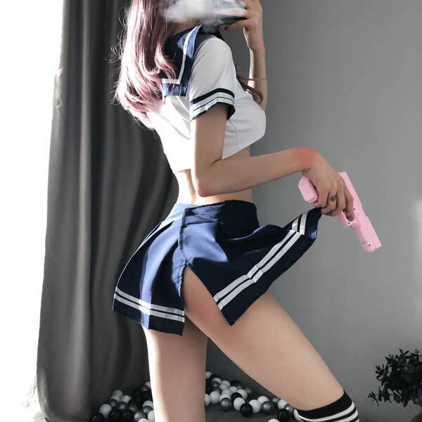 Sexy womens maid costume set featuring a short navy skirt with white stripes, sailor-style top, and thigh-high socks, perfect...