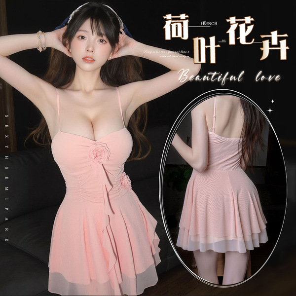 Woman modeling pink mannyqing lingerie dress with halter neck, mesh layers, and floral details. low-cut design for sexy sleep...