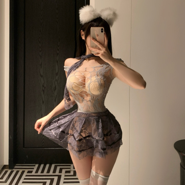 Woman in mist temptation lingerie set – sheer mesh sleepwear with cat ears, posing seductively in a dimly lit room.