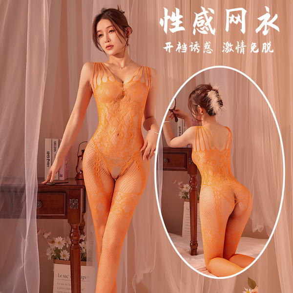Model wearing orange plus size lace fishnet bodystocking with tear-away crotch, shown front and back in bedroom setting.