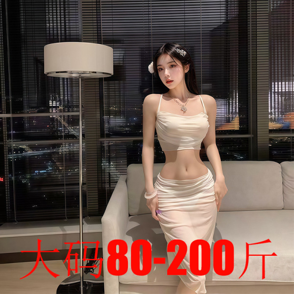 Woman wearing a white lace bodysuit dress with sheer panels, styled as elegant sleepwear in a modern living room setting.