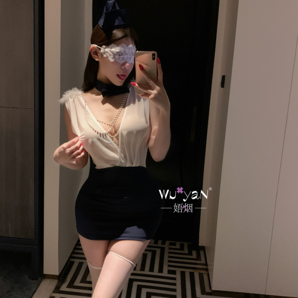 Woman in pure & tempting lingerie set, modest secretary style bodycon skirt sleepwear with lace mask and pearl necklace.