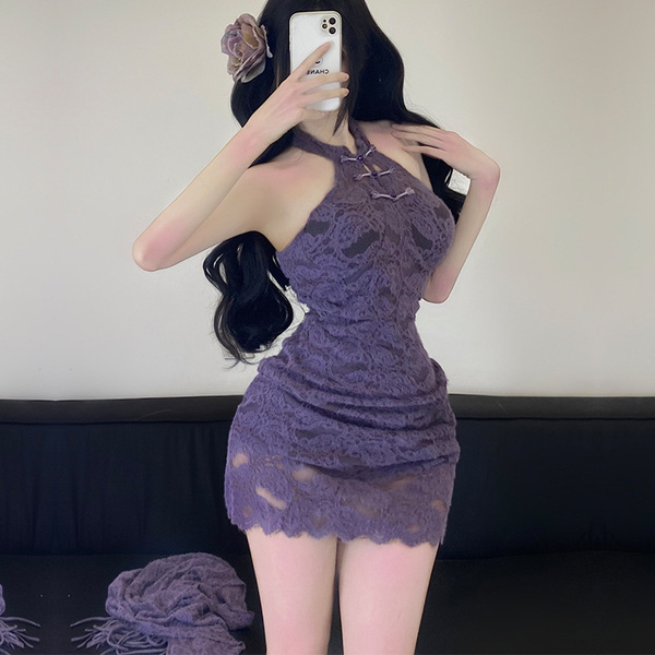 A woman poses in a purple lace cheongsam dress, featuring a halter neck design and intricate detailing. the bodycon silhouett...