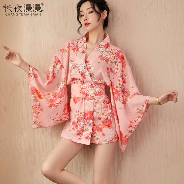 A woman models a pink floral patterned kimono-style dress with sheer sleeves, featuring a corset design, suitable for women s...