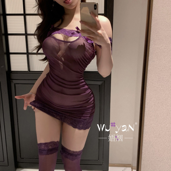 Woman in purple lace-trimmed sleepwear set, featuring sheer mesh and thigh-high stockings — seductive style for romantic ni...