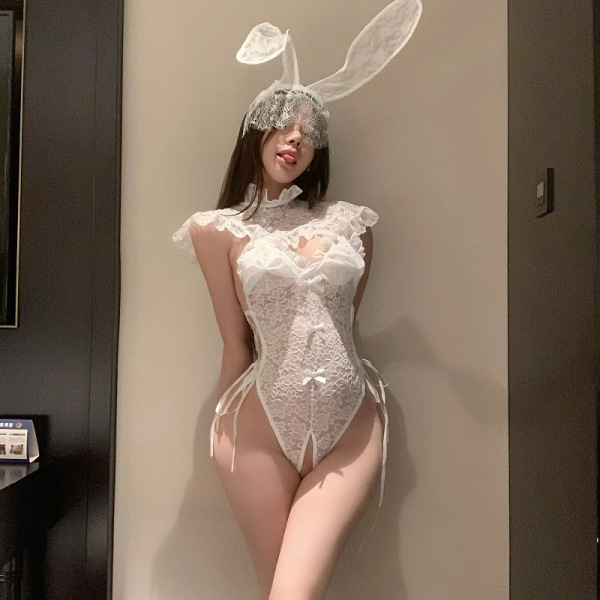 Woman wearing white lace bodysuit with bunny ears, featuring sheer vintage-inspired design and open-crotch detail for sensual...