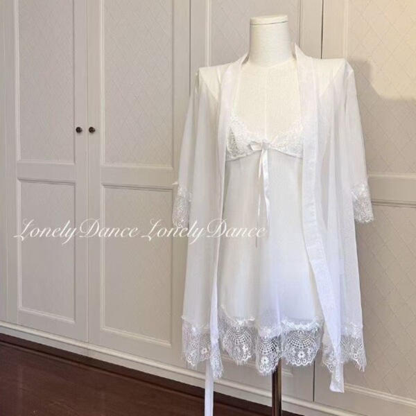 White sheer lace sleepwear set with cami, shorts & robe on mannequin.