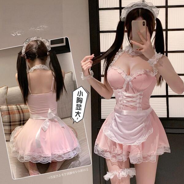 Woman modeling pink sexy maid costume with lace trim, corset bodice, and apron. seductive lingerie sleep dress and passionate...