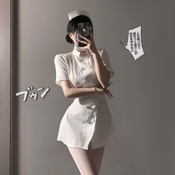 Woman in white sexy nurse costume lingerie set with bow-tie skirt and round neck top, posing seductively.