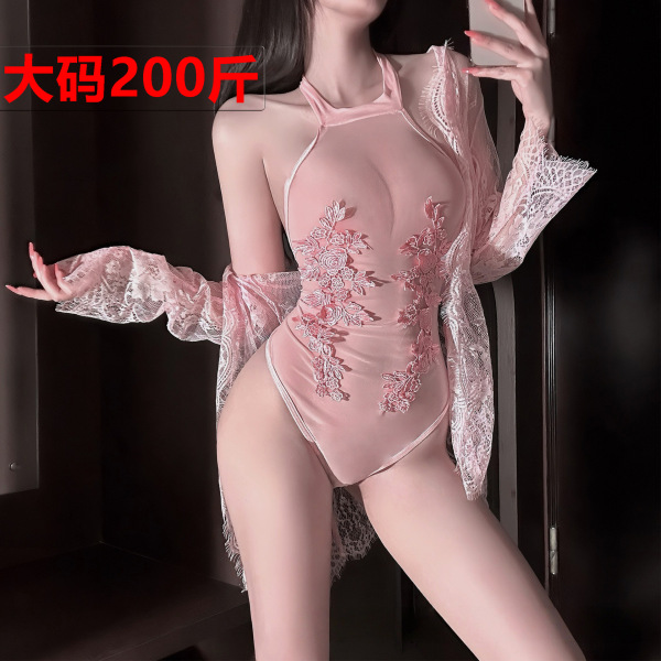Woman wearing a pink sheer lace bodysuit with floral embroidery and an open-crotch design.
