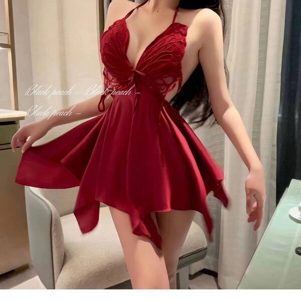 Woman wearing red butterfly lace sleeveless sleep dress with sheer back and bow detail, romantic spring lingerie set.
