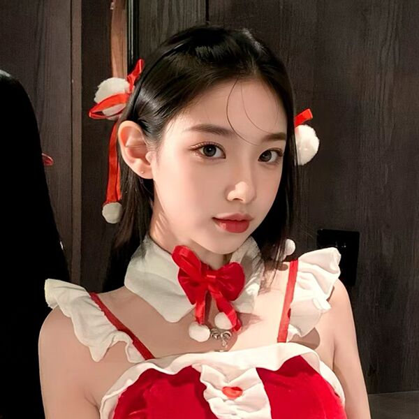 A young woman wears a festive christmas red velvet babydoll dress set, featuring lace details and a charming bow hair accesso...