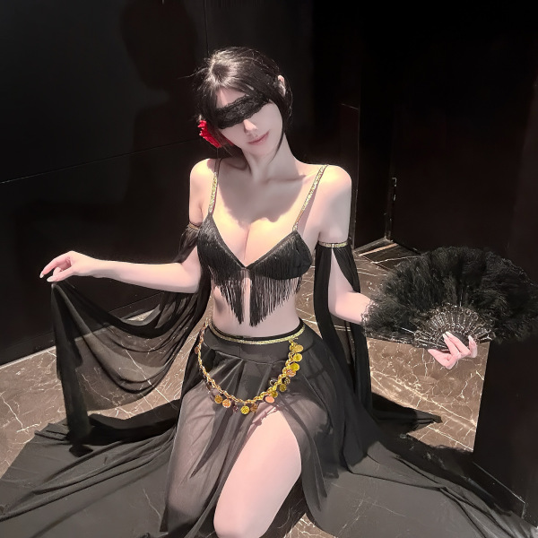 Woman in black fringed lingerie set with gold accents, holding feather fan and sheer fabric, exuding elegance and sensuality.