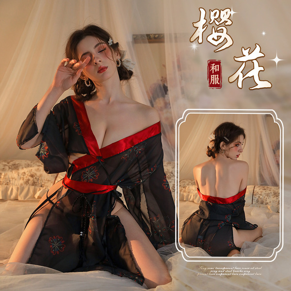 A woman poses elegantly wearing a black floral kimono-style sleepwear set, featuring red accents and intricate designs. the o...
