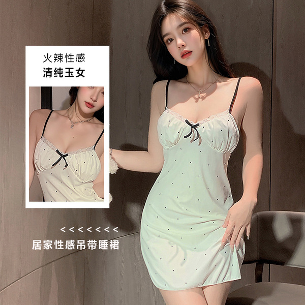 Flirty lace sleepwear set featuring adjustable straps, delicate bow detail, and feminine design.
