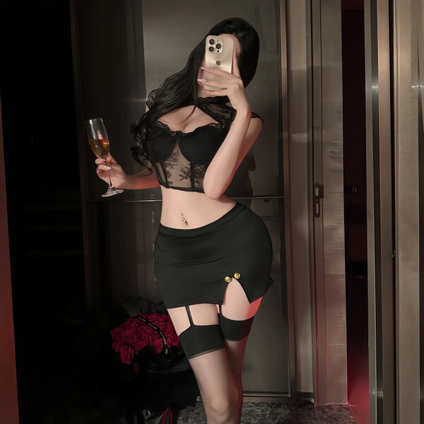 A woman poses in a luxurious setting, wearing a nightsiyese lace babydoll set. the outfit features a sheer mesh bodysuit with...