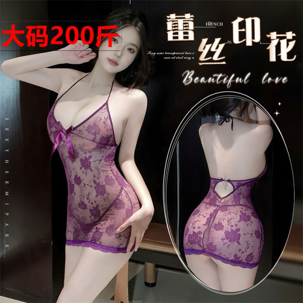 Woman modeling plus size purple lace lingerie sleep dress with sheer floral pattern and bow detail, back view shown.