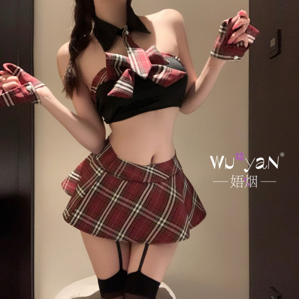 Woman wearing a red plaid jk uniform style lingerie set with a crop top, mini skirt, and thigh-high stockings.