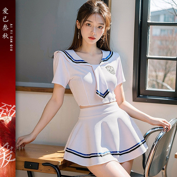 A stylish sailor uniform set featuring a white crop top with navy accents and a matching pleated skirt, perfect for role play...