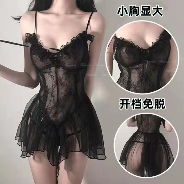 Woman wearing black sheer lace sleepwear set with mesh camisole and backless slip dress, featuring ruffled hem and open-crotc...