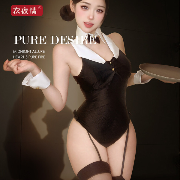 Woman in black bunny girl bodysuit with white collar and cuffs, holding a tray.