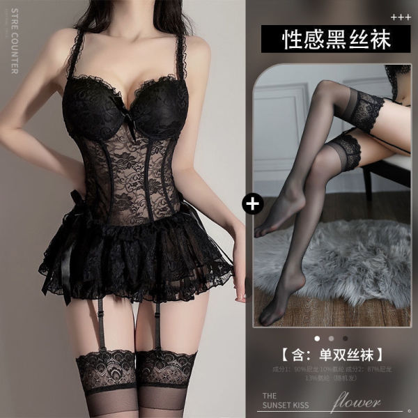 Woman modeling black lace bodysuit with sheer mesh, ruffled skirt, and matching thigh-high stockings.