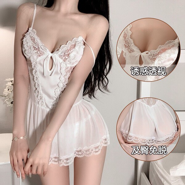 Woman wearing a white lace sheer sleep dress with delicate straps and floral details, showcasing its sweet and alluring desig...