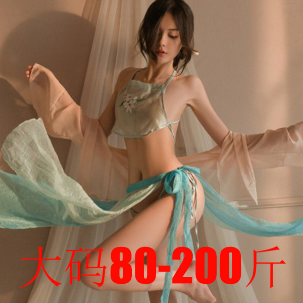 Woman wearing a sheer, light blue hanfu-inspired belly dance top and matching skirt with flowing sleeves, styled in a modern ...