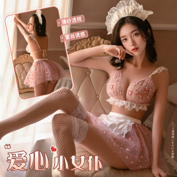 Woman modeling pink sheer sweetheart maid costume with lace trim, heart print lingerie top, mini skirt and fishnet stockings.