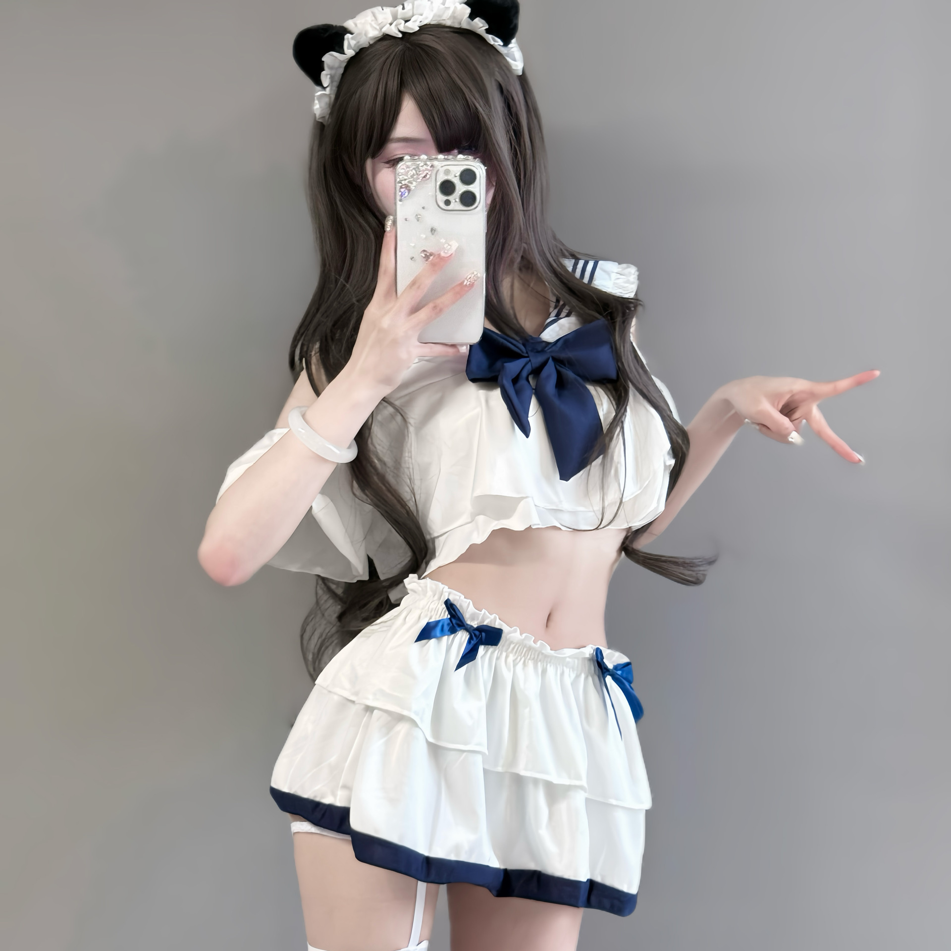 Seductive schoolgirl lingerie set featuring a charming uniform outfit with ruffled layers, navy accents, and playful cat ears...