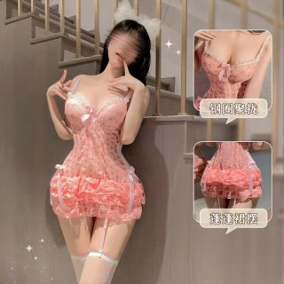 Woman modeling pink french-style lace corset top with bow backless bralette, push-up cups, and cherry cake dress details.