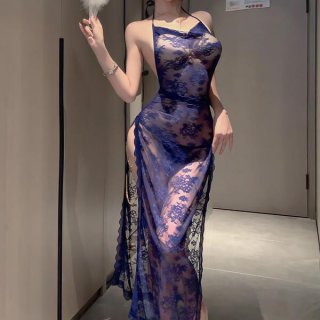Woman wearing a seductive blue lace lingerie set with sheer straps and floral patterns, featuring a modest yet alluring desig...