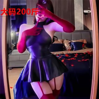 A woman poses in a mirror wearing a plus size sexy lingerie set featuring a sheer pleated mini leather skirt and busty oi uni...