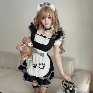 A woman wearing a maid costume cosplay dress, featuring a black and white apron with cat paw prints, holding a teddy bear and...
