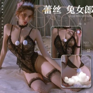 Woman modeling mannyan sexy lace bunny costume with floral trim, adjustable straps, and fishnet stockings for role play.