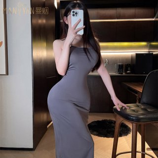 A woman poses in a stylish gray bodycon dress, highlighting its form-fitting design and elegant simplicity. the dress feature...