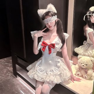 A woman poses in a maid-inspired lolita outfit featuring a white dress with lace details, a red bow, and cat ears. she wears ...