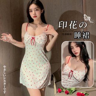 Woman wearing a sexy lace babydoll sleep set with built-in pads, featuring red polka dots and a bow detail.