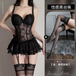 Woman modeling black lace bodysuit with sheer mesh, ruffled skirt, and matching thigh-high stockings.